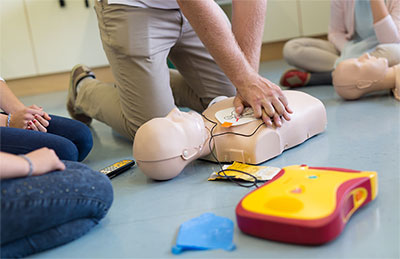 CPR instructor showing proper technique
