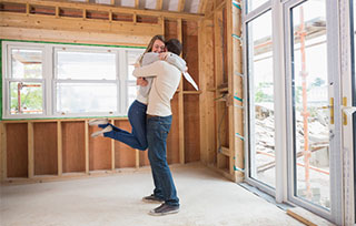 Couple celebrating building their home