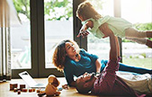 Parents playing with their child